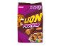 Céréales de petit-déjeuner chocolat et caramel avec protéines, dans un bol de lait.