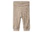 Pantalon bébé côtelé beige avec taille repliable.
