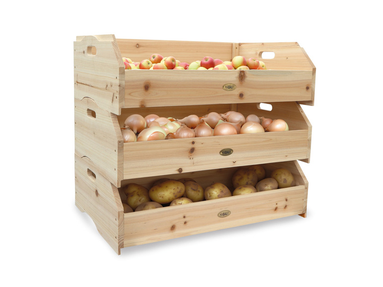 Trois boîtes de rangement en bois Habau avec des pommes, des oignons et des pommes de terre.