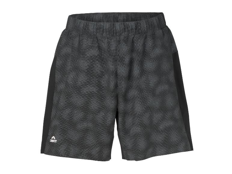 Short de sport gris foncé avec des empiècements latéraux noirs et un motif subtil.