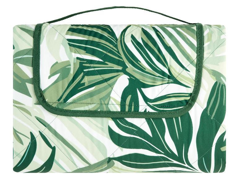 Couverture de pique-nique matelassée à motif tropical vert.