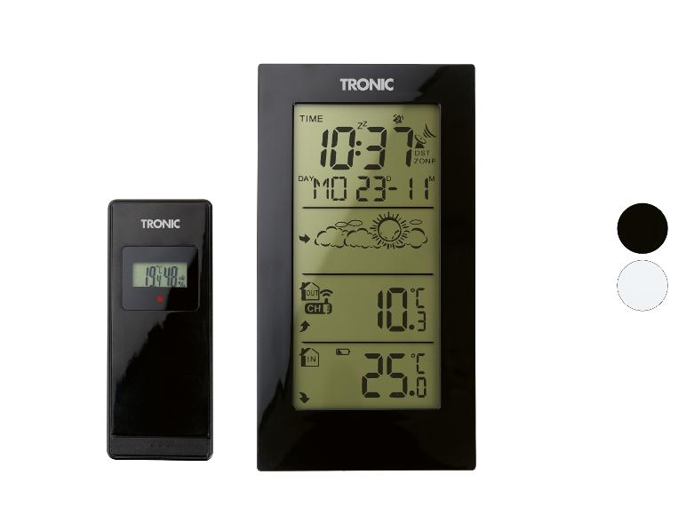 Station météo numérique avec écran LCD et capteur extérieur, affichant température et humidité.
