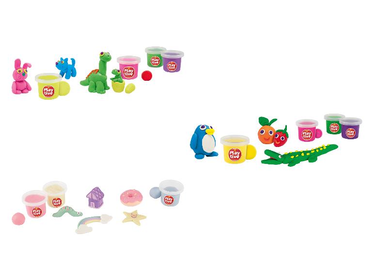 Play-Doh avec des figurines d'animaux et de fruits, y compris des pots de Play-Doh.