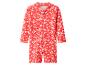 Maillot de bain rouge à manches longues pour enfants avec imprimé floral blanc.