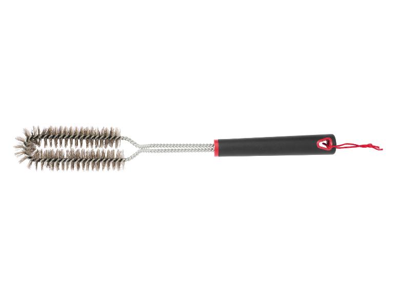 Une brosse de nettoyage pour barbecue avec deux brosses et une poignée noire.