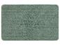 Un tapis de bain vert avec une surface texturée.
