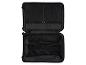 Intérieur ouvert d'une valise noire Esmara avec sangles de compression et poches zippées.