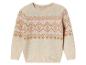 Pull beige avec un motif géométrique en nuances de rose et d'or.