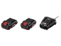 Deux batteries d'outils et un chargeur, tous en noir et rouge.
