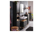 Une salle de bain avec un lavabo, un miroir et une armoire noire.