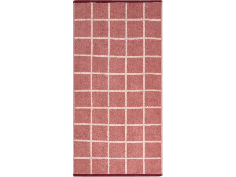 Tapis de bain rose avec un motif quadrillé blanc