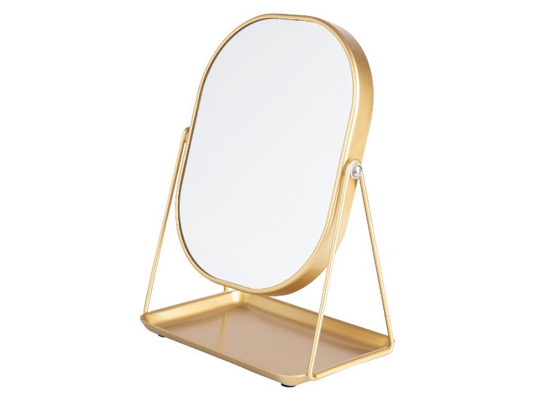 Miroir de maquillage doré avec plateau.