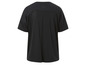 Un t-shirt noir Adidas avec des panneaux en mesh au dos.
