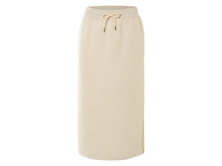 Une jupe longue en tricot beige avec cordon.