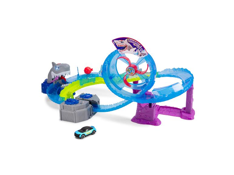 Ensemble de jeu Hot Wheels sur le thème du requin avec piste bleue et voiture turquoise.
