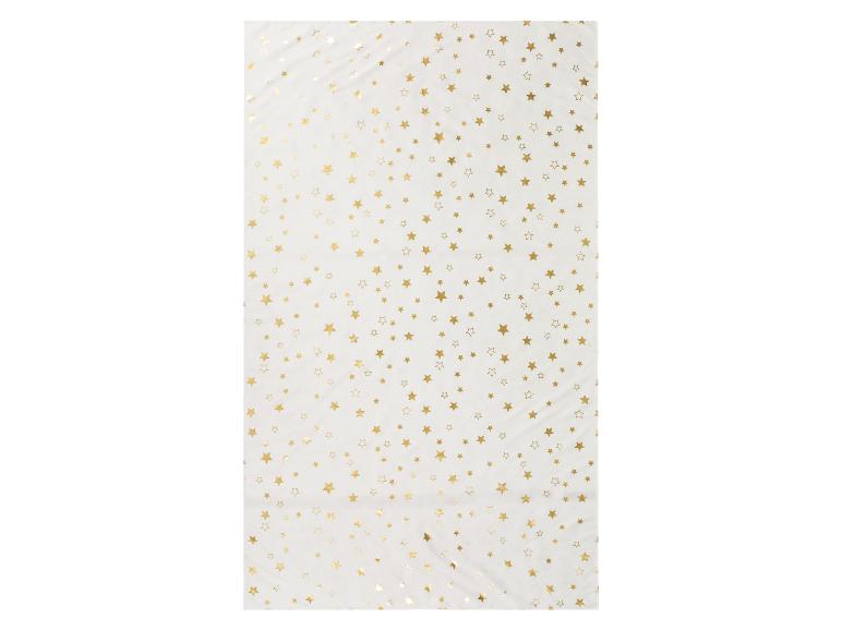 Papier blanc avec des étoiles dorées.