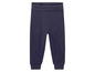 Pantalon de survêtement bleu foncé avec taille élastique.