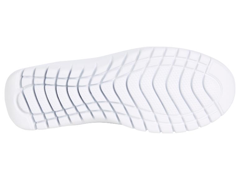 Semelle en caoutchouc blanche d'une chaussure de sport.