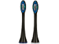 Deux têtes de brosse à dents électriques de rechange noires avec des poils bleus, blancs et verts.