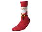 Chaussette rouge avec motif Père Noël, incluant visage, barbe, ceinture et boutons.