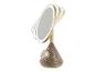 Miroir de maquillage lumineux doré avec haut-parleur et chargeur sans fil.