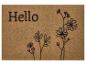 Paillasson marron avec le texte « Hello » et des fleurs stylisées.
