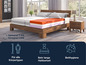 Un lit avec un matelas multicouche, adapté à tous les types de corps.