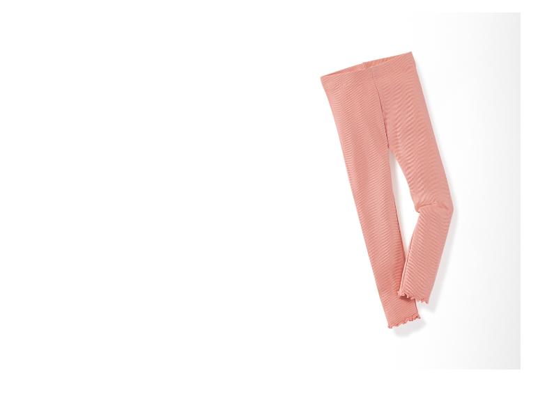 Leggings roses en tissu côtelé avec un ourlet festonné.