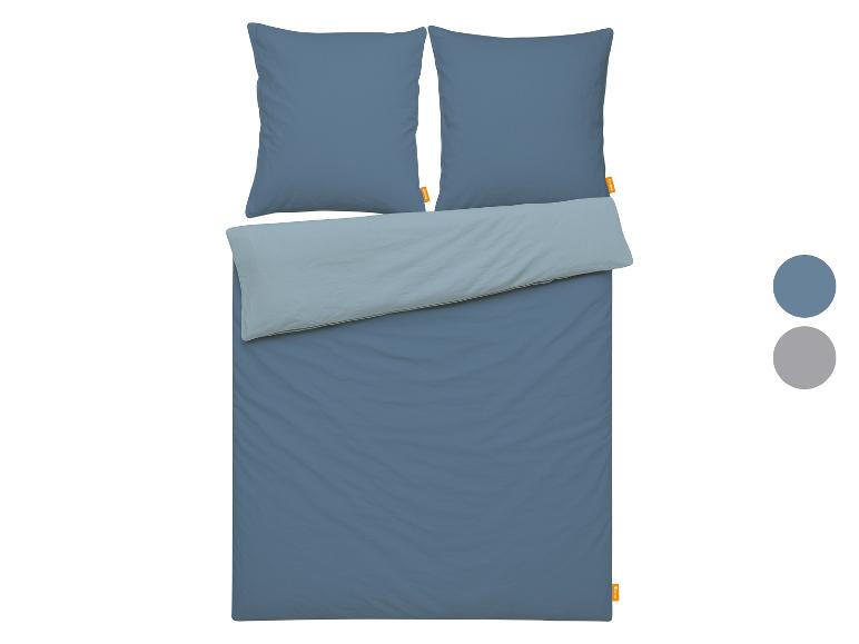 Housse de couette réversible bleue et bleu clair avec deux taies d'oreiller.