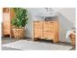 Meuble-vasque en bois clair, lavabo et rangements assortis.