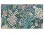 Tapis et sets de table à motif floral bleu-vert.