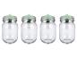 Quatre bocaux en verre avec couvercles métalliques et valves de fermentation vertes