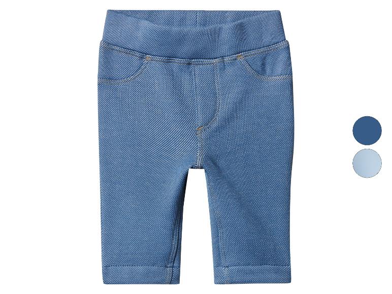 Legging jean bleu pour enfant avec taille élastique et fausses poches.