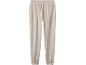 Pantalon de jogging beige avec taille élastique et chevilles resserrées.