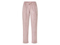 Un pantalon de jogging rose avec cordon.