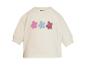 Pull bébé écru avec trois fleurs brodées roses, bleues et bordeaux.