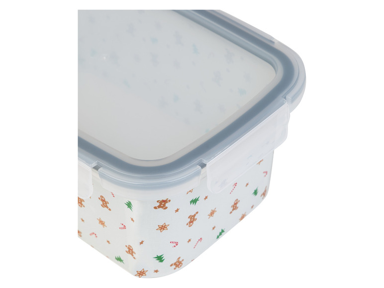 Une boîte de conservation rectangulaire transparente avec un motif pain d'épices.