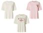 Trois t-shirts femme : blanc, rose avec 'Beach Resort' et crème avec 'Hawaii Aloha'.