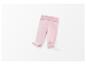 Leggings rose pour bébé avec couvre-pieds.