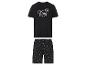 Un pyjama noir avec un t-shirt qui dit 'King' et un pantalon à motif couronne.