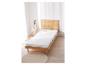 Matelas en mousse confort LIVARNO HOME Easy H2 sur un lit en bois dans une chambre lumineuse.
