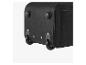 Partie inférieure d'une valise de voyage noire avec roues et supports.
