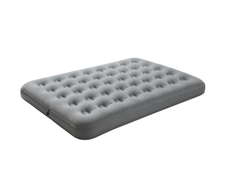 Matelas gonflable gris avec surface rainurée, vue de dessus.