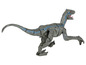 Un jouet de vélociraptor Jurassic World gris et bleu sur roues.