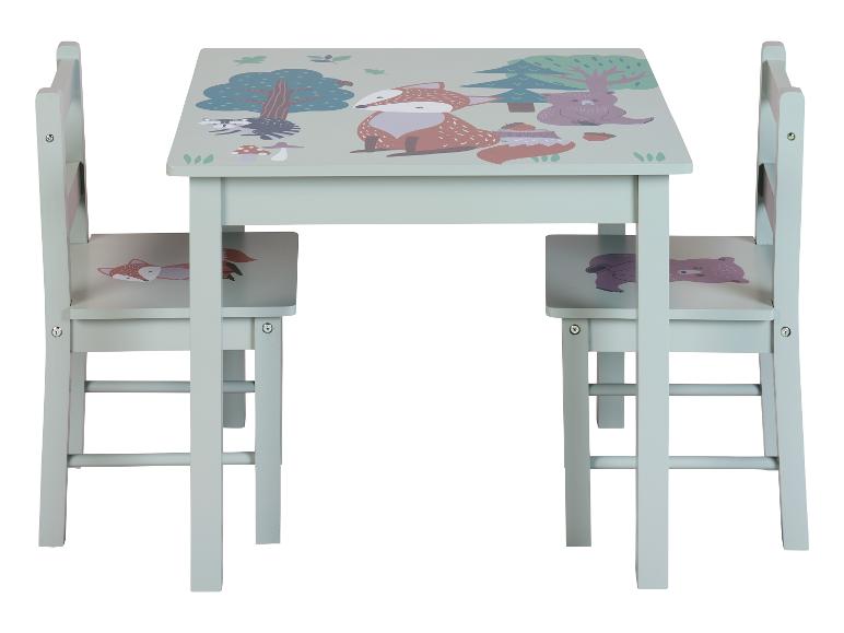 Table et deux chaises pour enfants avec des motifs d'animaux de la forêt.
