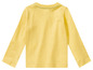 Un t-shirt jaune à manches longues pour bébé.