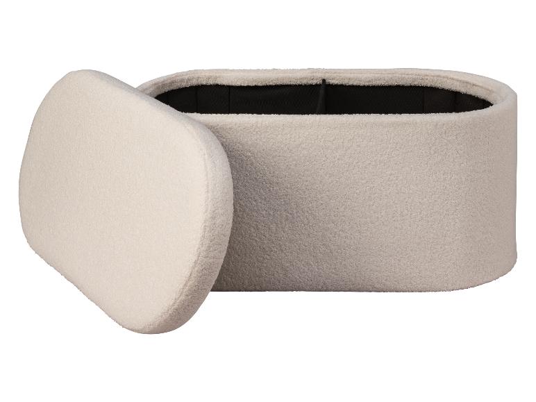 Pouf ovale moelleux avec couvercle amovible.