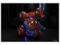 Voiture jouet Spider-Man avec lumières, sur une surface sombre.