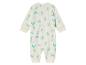 Combinaison pour bébé avec un motif de dinosaures.
