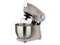 Un robot de cuisine Berger beige avec un bol en acier inoxydable et un fouet.